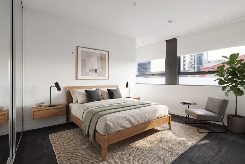 A bedroom shot against a bright window, enhanced so the bed, the carpet and the buildings outside the glass are all correctly exposed